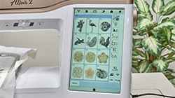 Detail of LCD screen showing embroidery designs and stitches on Baby Lock Altair 2